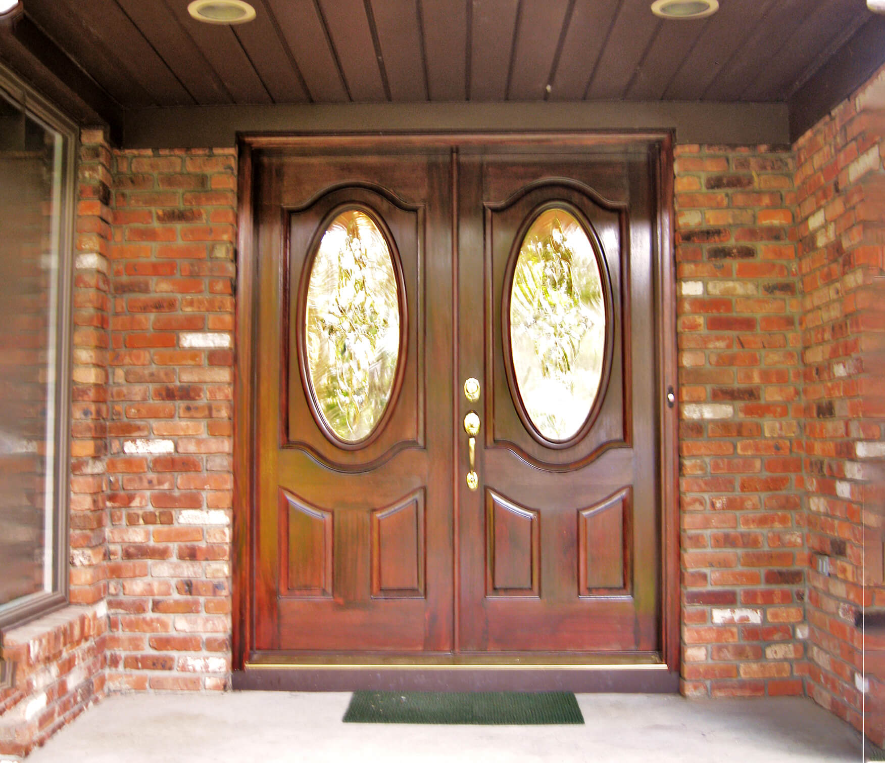 Wood double door brick entry image