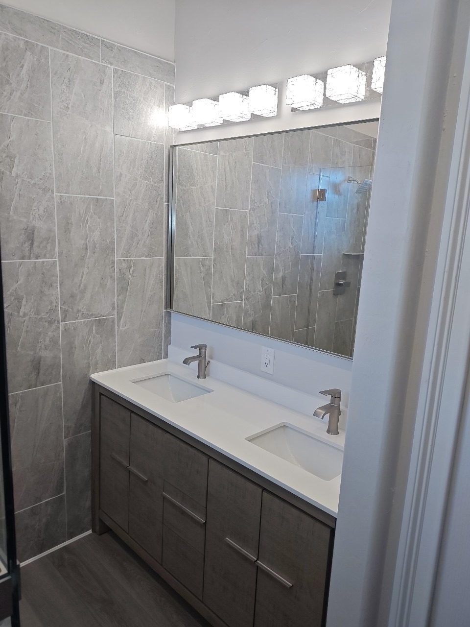 Gray tile double sink bathroom image