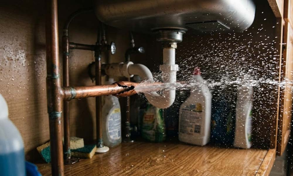 Burst pipe spraying water